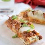 slices of Lasagna Bread Pizza on a cutting board