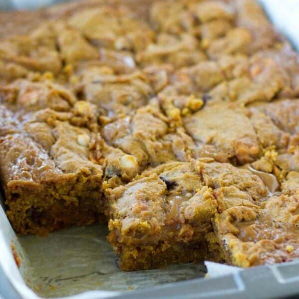 pan of Loaded Caramel Pumpkin Blondies with a few taken out.