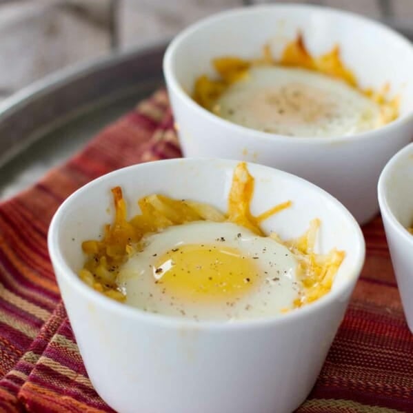 Individual ramekins with Mexican Style Eggs in a Nest