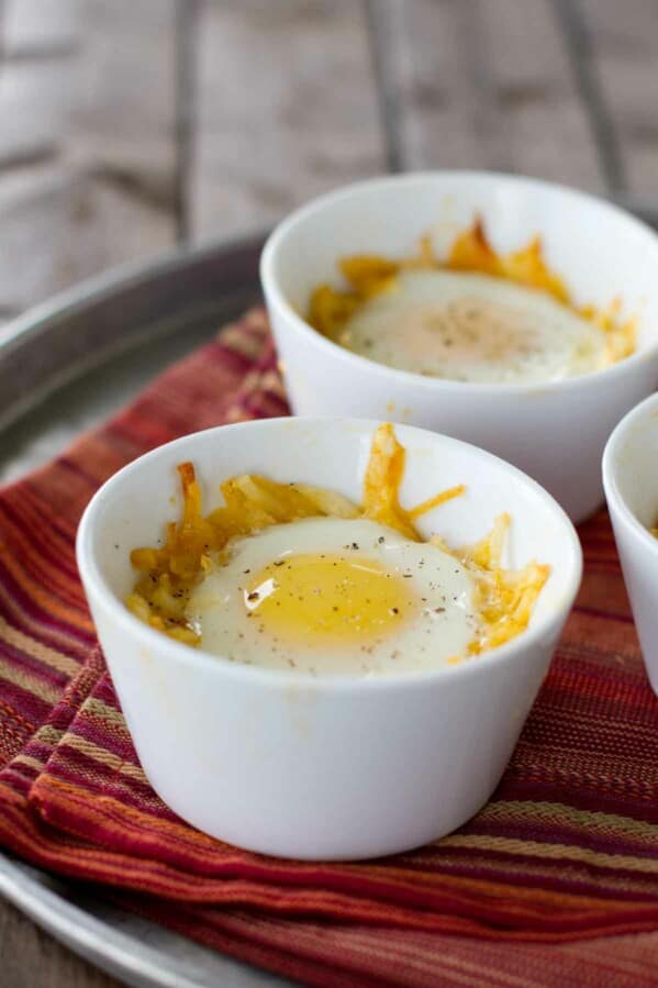 Individual ramekins with Mexican Style Eggs in a Nest