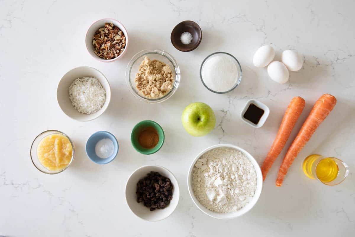 Filled with all kinds of good for ingredients, these Morning Glory Muffins are the perfect way to start the morning! Carrots, apples, raisins, coconut, and nuts fill these hearty and tasty muffins. ingredients needed to make morning glory muffins