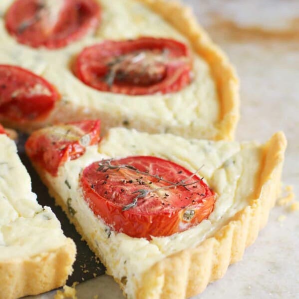 Polenta Crust Tomato Tart with a slice cut out