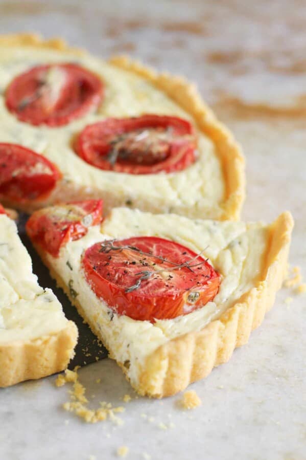 Polenta Crust Tomato Tart with a slice cut out