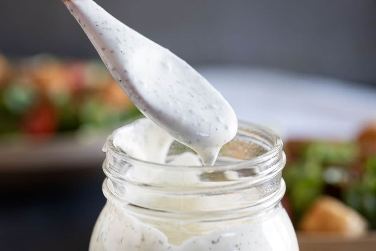 spoonful of ranch dressing over a mason jar
