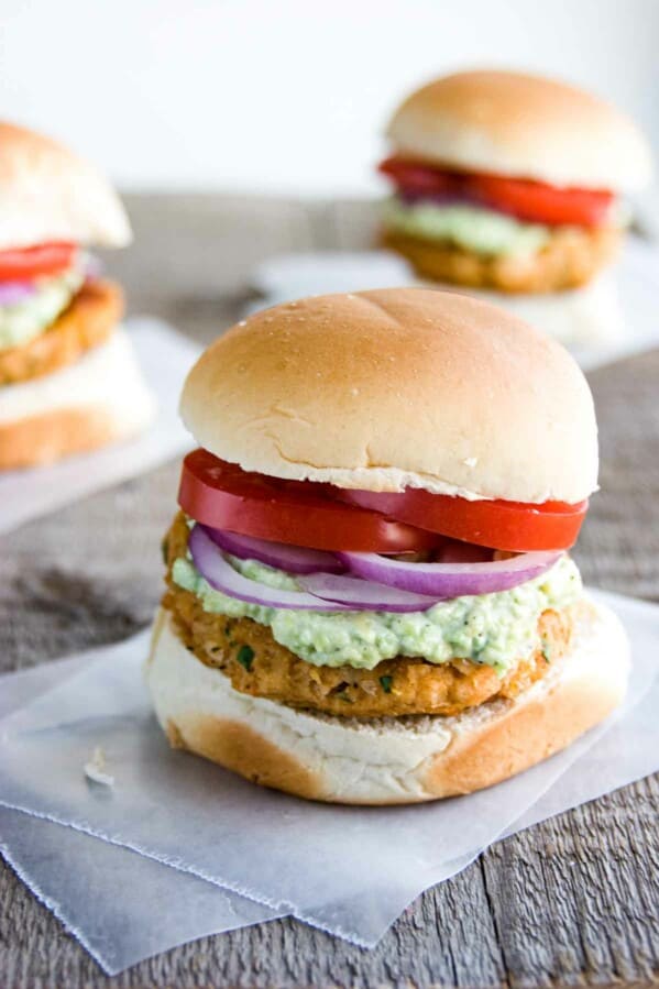 Southwestern Bean Burgers with avocado mayonnaise, tomatoes, and red onions