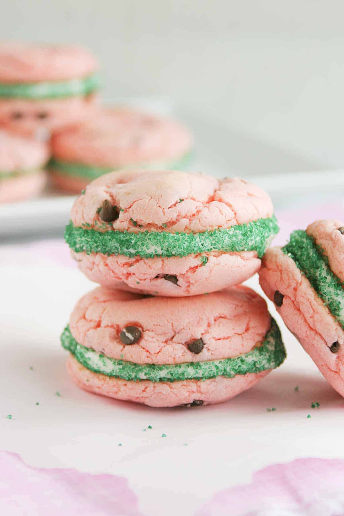 Watermelon Cake Mix Cookie Sandwiches stacked on top of each other
