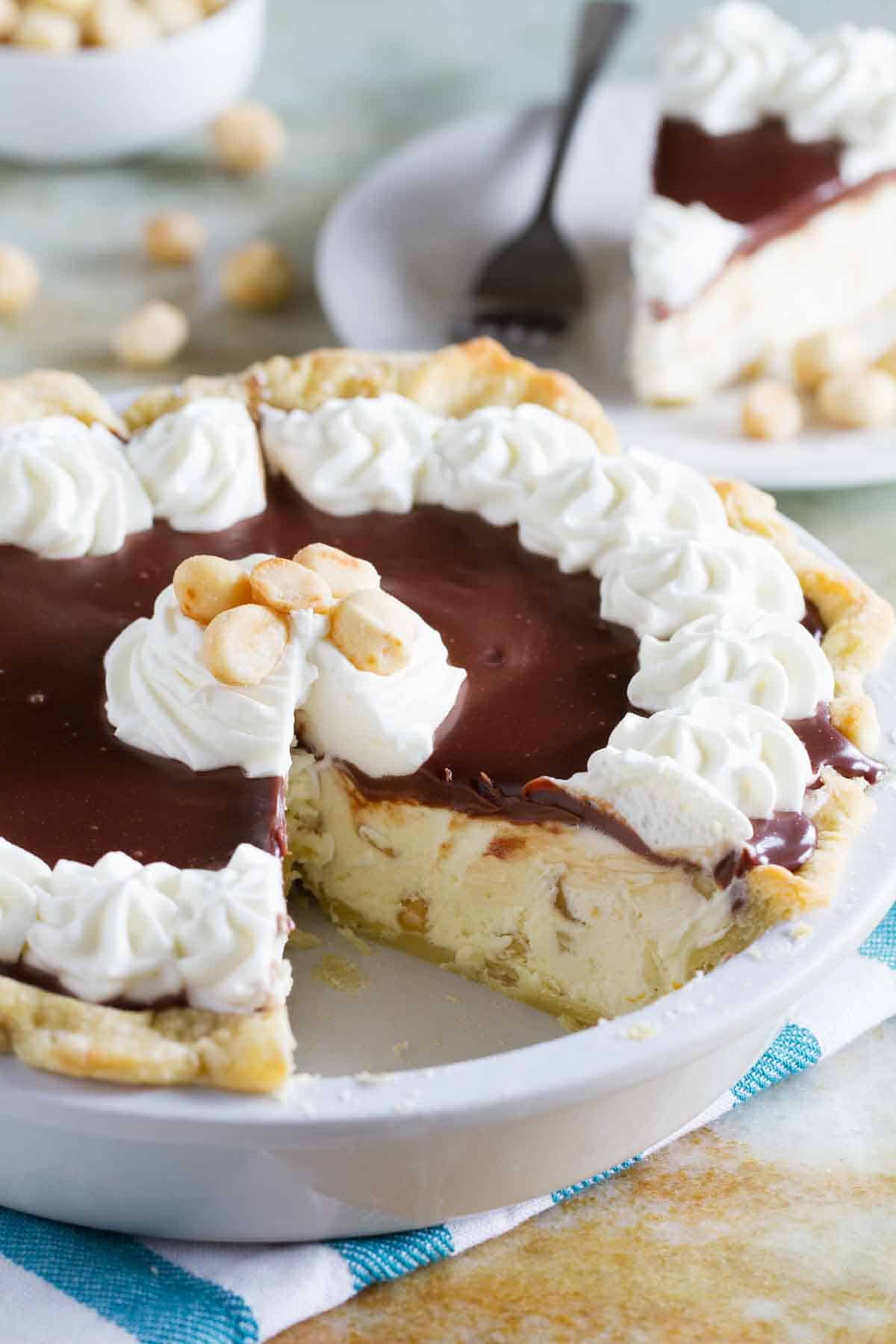 white chocolate macadamia pie with a slice taken from it