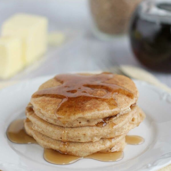 four whole wheat blender pancakes topped with syrup