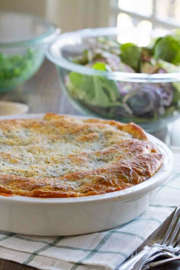 full Zesty Italian Crescent Casserole with a salad behind