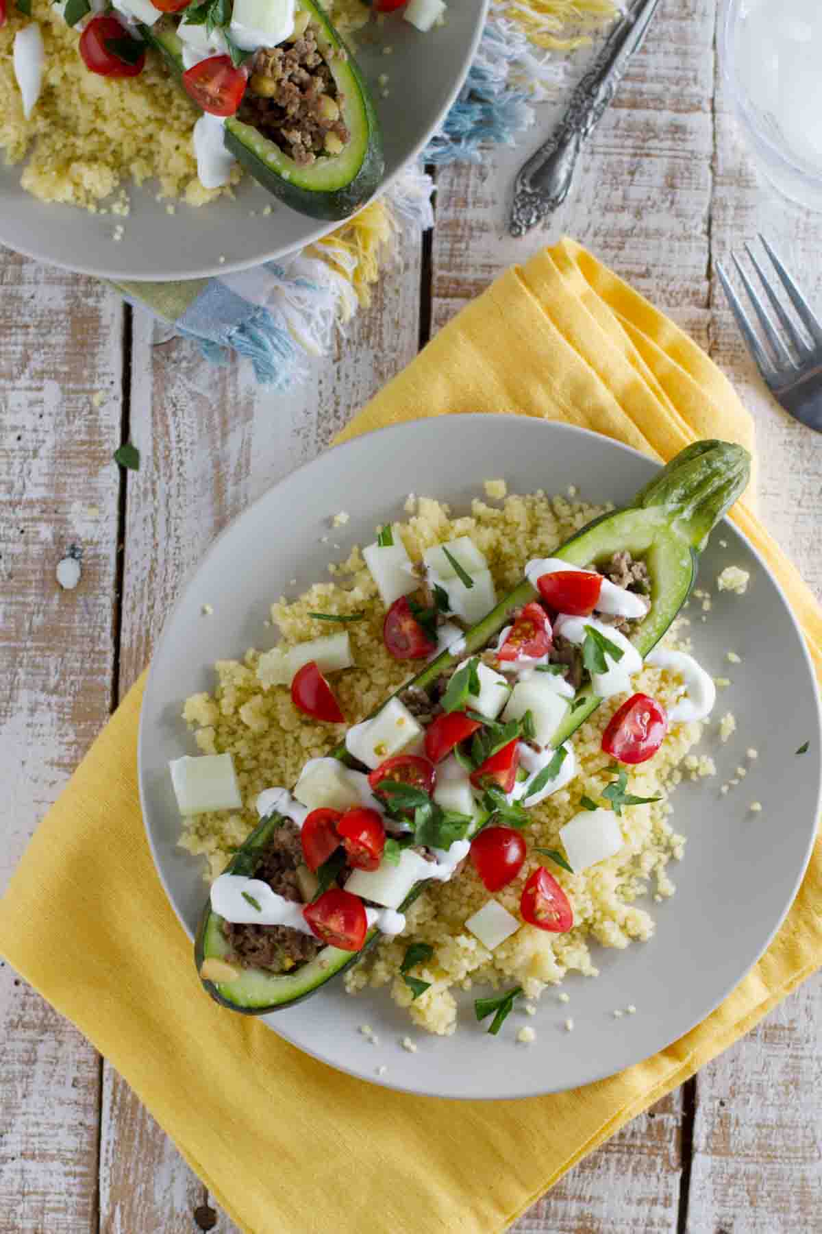 overhead view of zucchini boats with lots of toppings