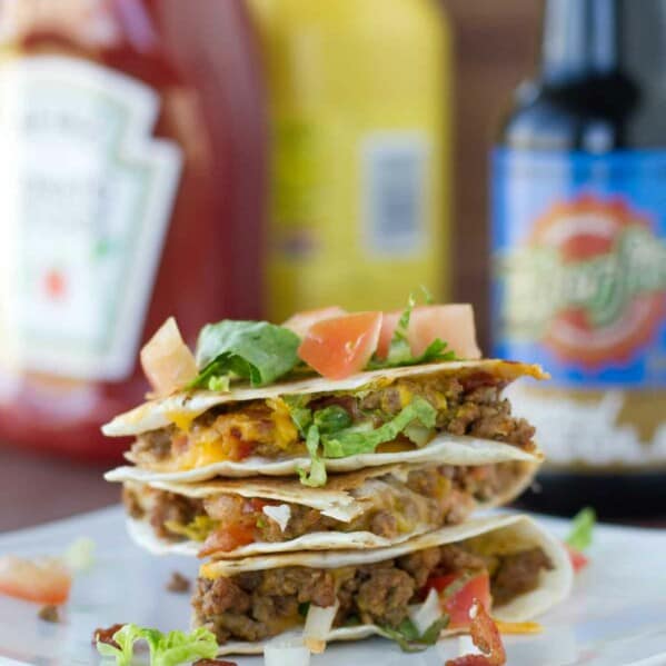 Bacon Cheeseburger Quesadillas stacked on a plate
