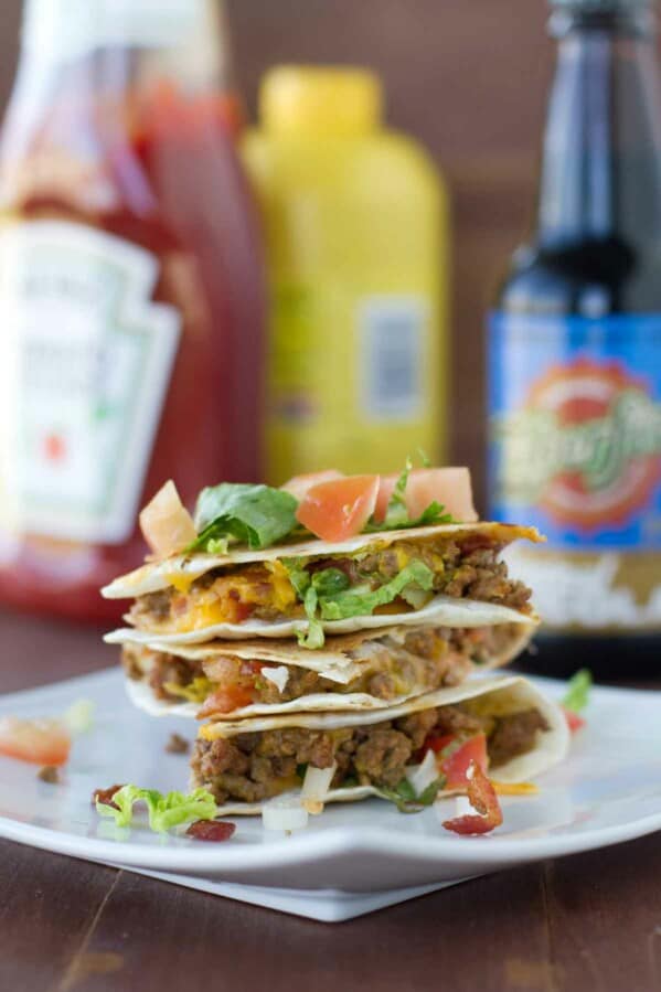 Bacon Cheeseburger Quesadillas stacked on a plate