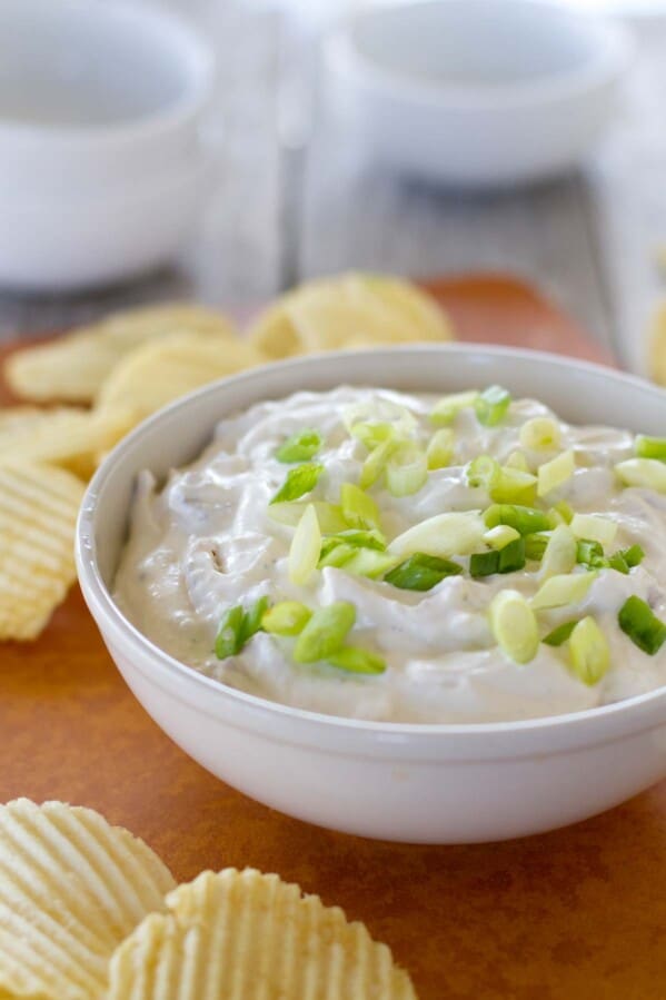 bowl of bacon horseradish dip topped with green onions