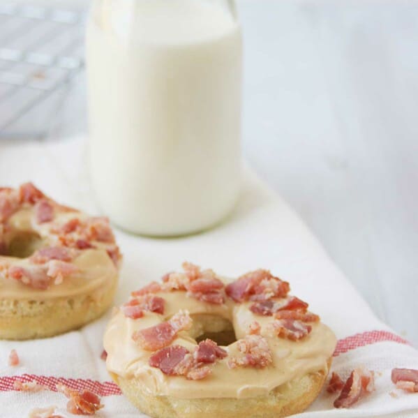 Banana Baked Donuts with Peanut Butter and Bacon with milk behind