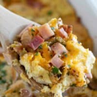 scoop of breakfast casserole with ham and cheese