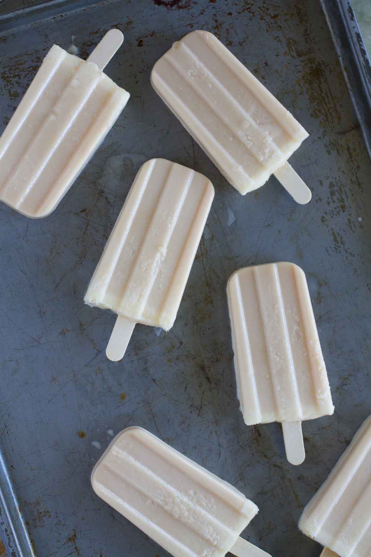 overhead view of Butterscotch Popsicles on a baking sheet