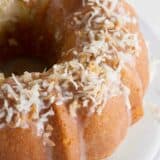 toasted coconut on top of a coconut bundt cake