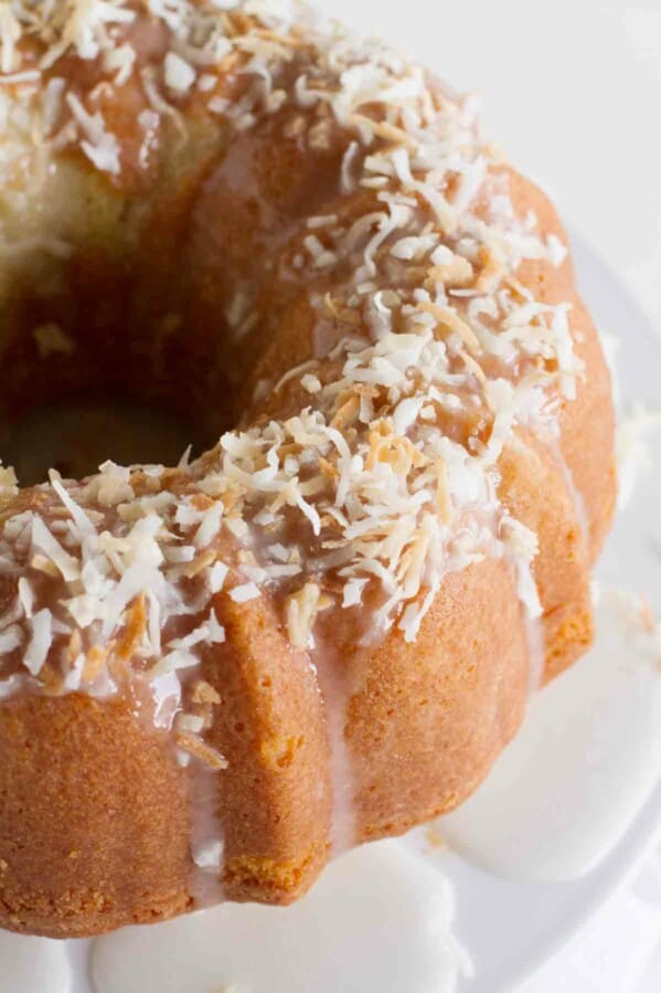 toasted coconut on top of a coconut bundt cake