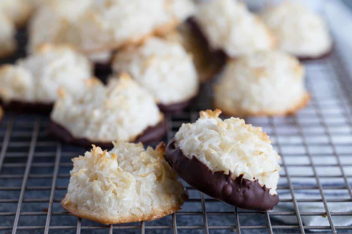Lightly crispy on the outside and chewy on the inside, these Coconut Macaroons are made for coconut lovers! Dip the bottoms in chocolate for an even more decadent treat. Coconut Macaroons both chocolate dipped and not dipped
