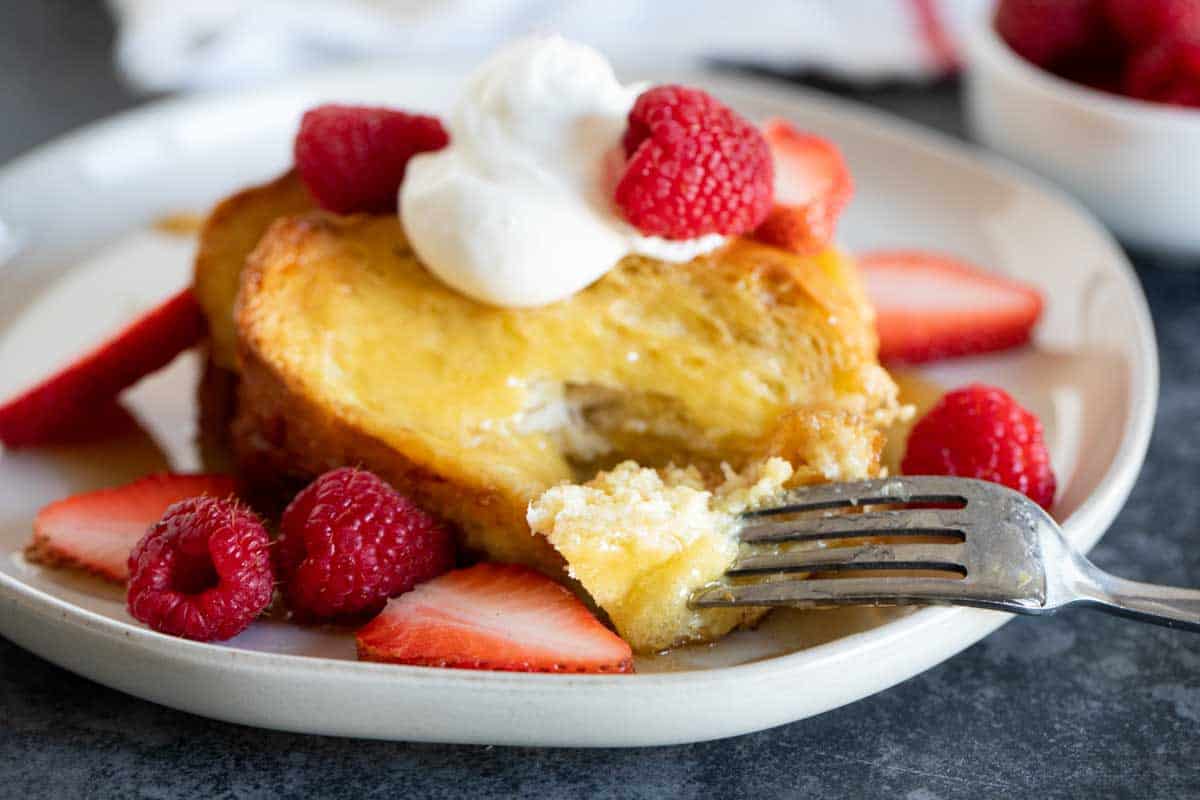 Forkful of Creme Brulee French Toast on a plate.