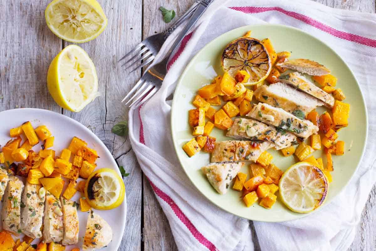 Two plates with Easy Lemon Chicken with Butternut Squash