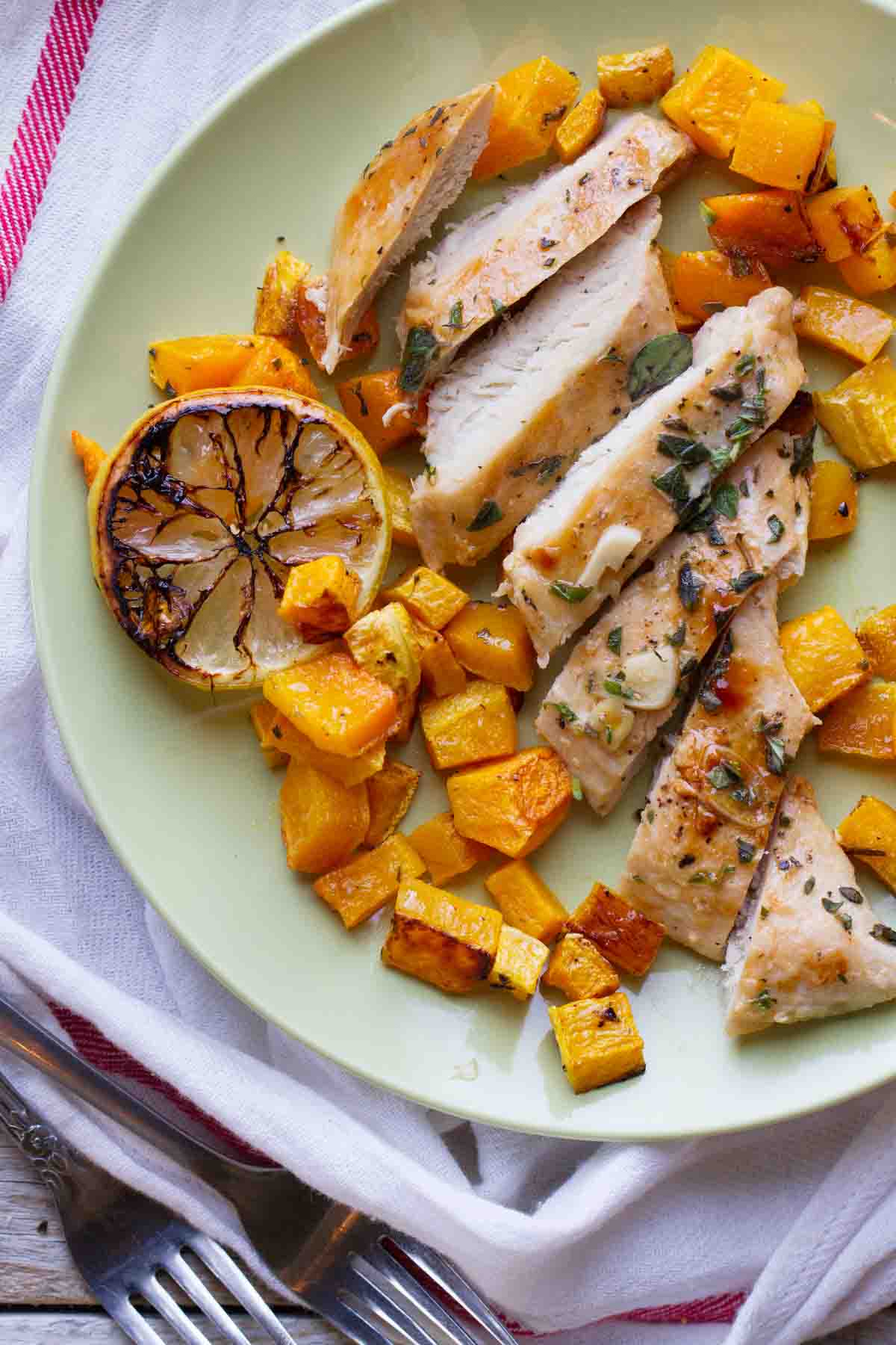 plate with Lemon Chicken with Butternut Squash with grilled lemon