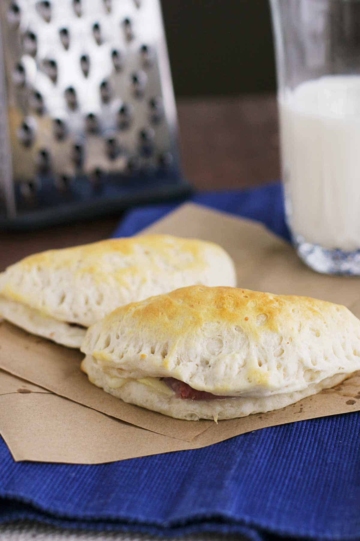 2 Ham and Cheese Pockets on brown paper