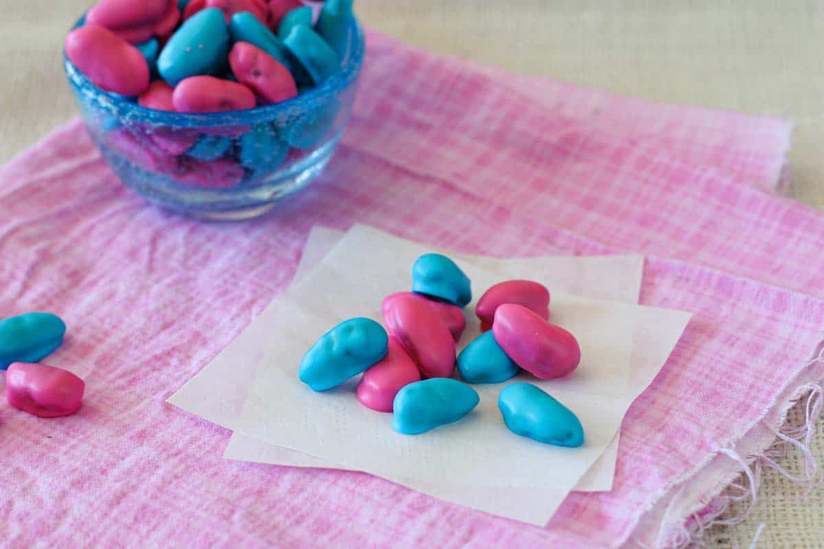 A homemade version of Jordan Almonds - whole almonds coated in a candy coating. blue and pink homemade Jordan almonds