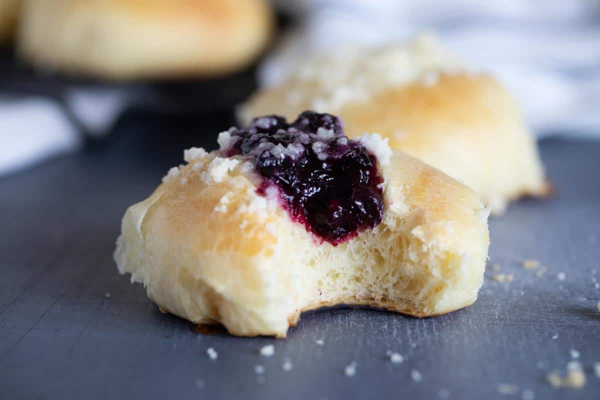 blueberry kolache with a bite taken from it