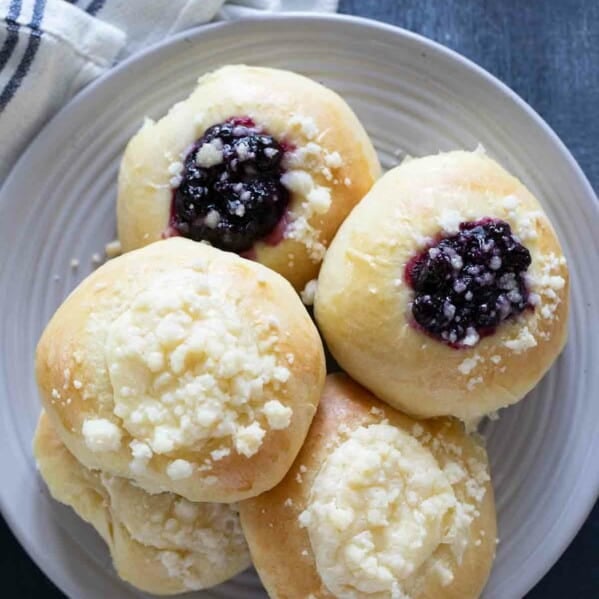 cream cheese and blueberry filled kolaches on a plate