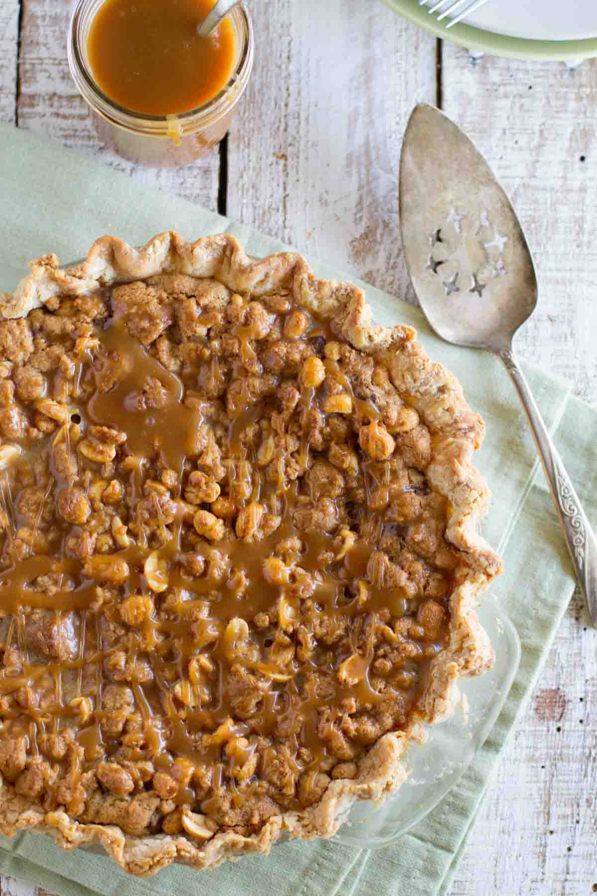 Peanut Butter Fudge Pie with caramel and peanuts on top.