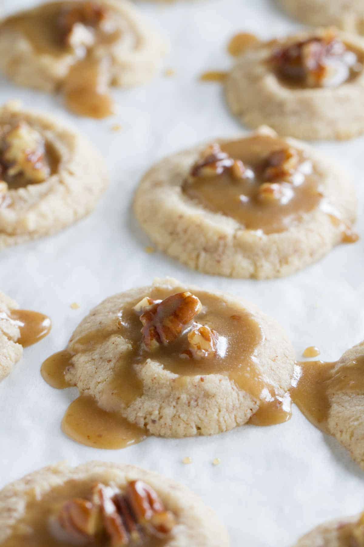 adding filling to pecan praline thumbprints