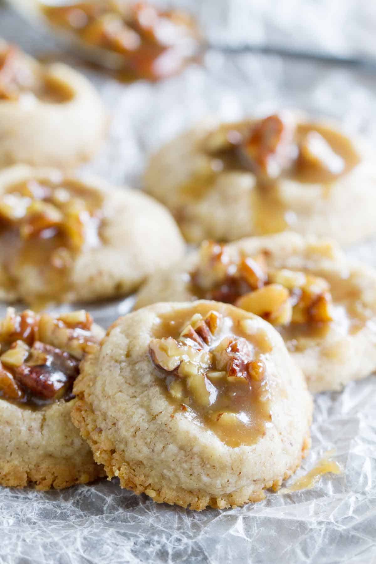 Pecan Praline Thumbprint cookies stacked on each other