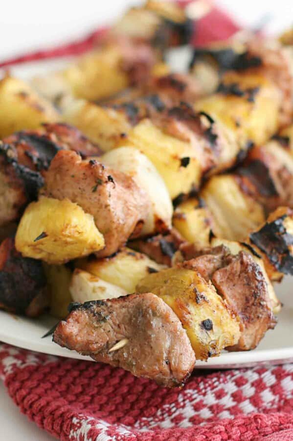 close up of grilled pineapple and pork kabobs