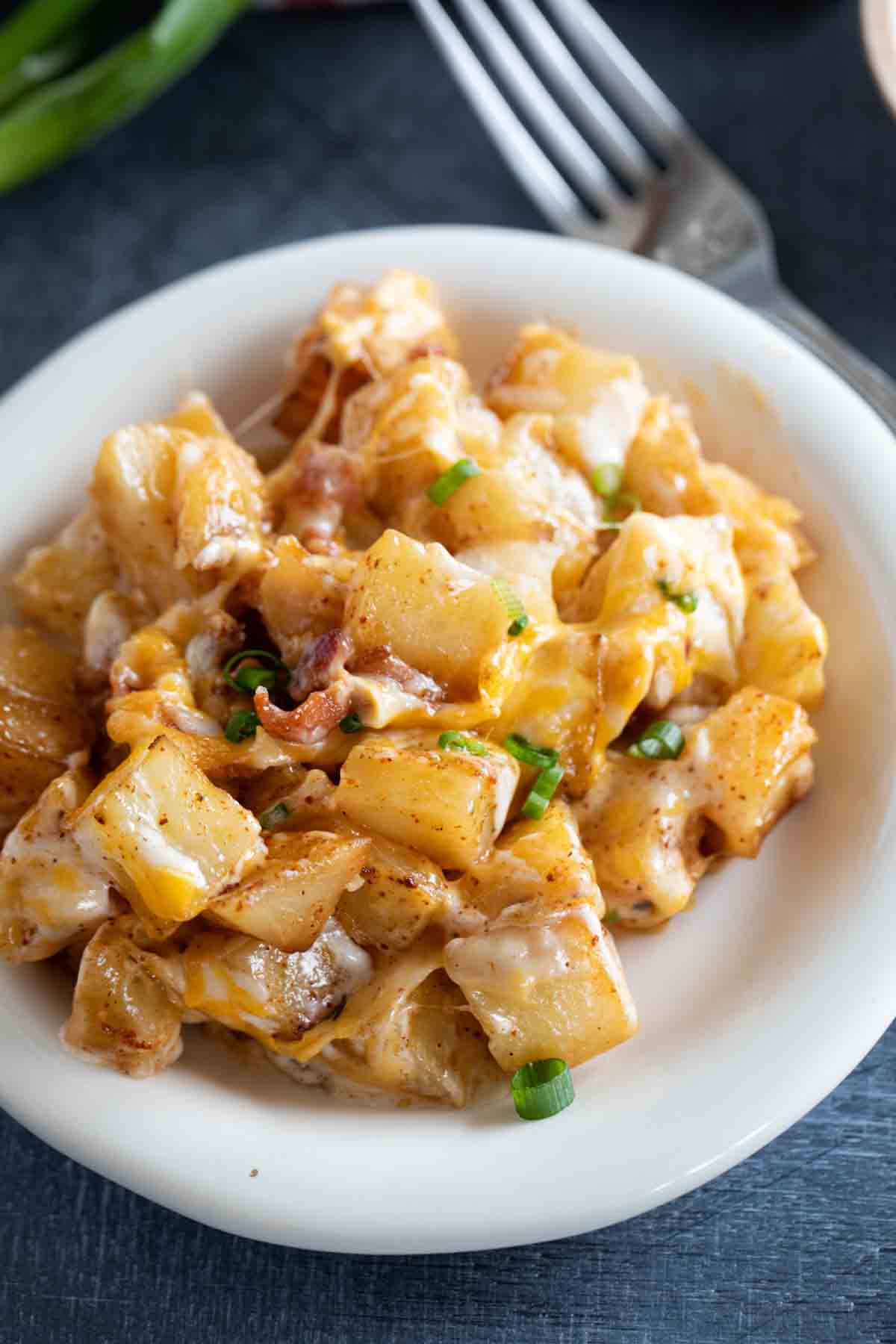 plate with ranch potatoes topped with green onions