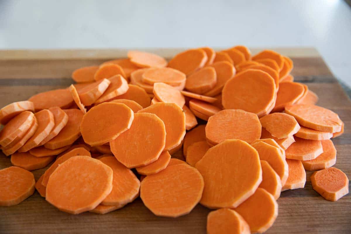 sliced sweet potatoes on a cutting board