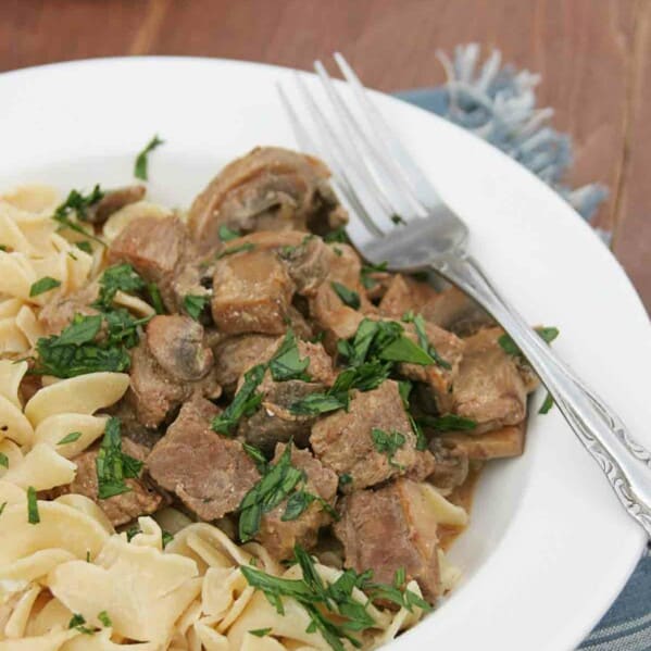 Slow Cooker Beef Stroganoff with noodles and parsley