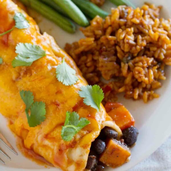 close up of vegetarian enchilada made with sweet potatoes and black beans.