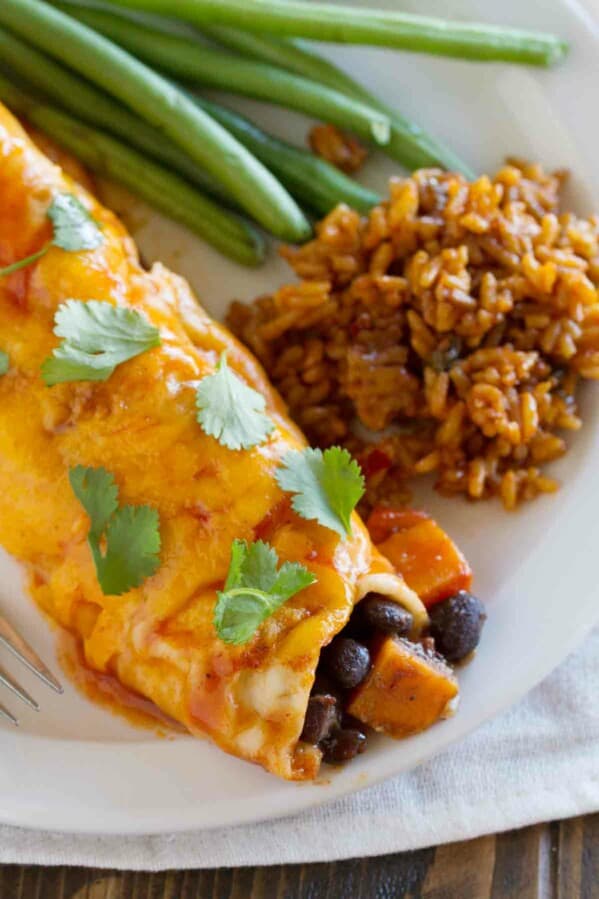 close up of vegetarian enchilada made with sweet potatoes and black beans.