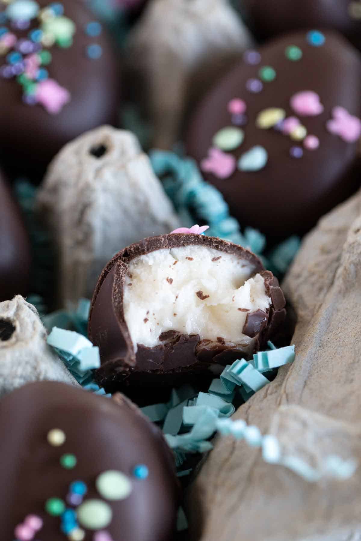 marshmallow creme truffle with a bite taken to show inside texture