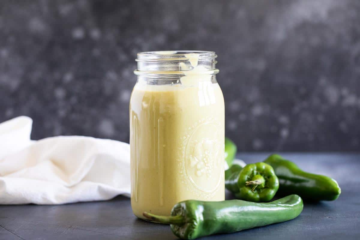 Mason jar of Green Enchilada Sauce with anaheim chiles