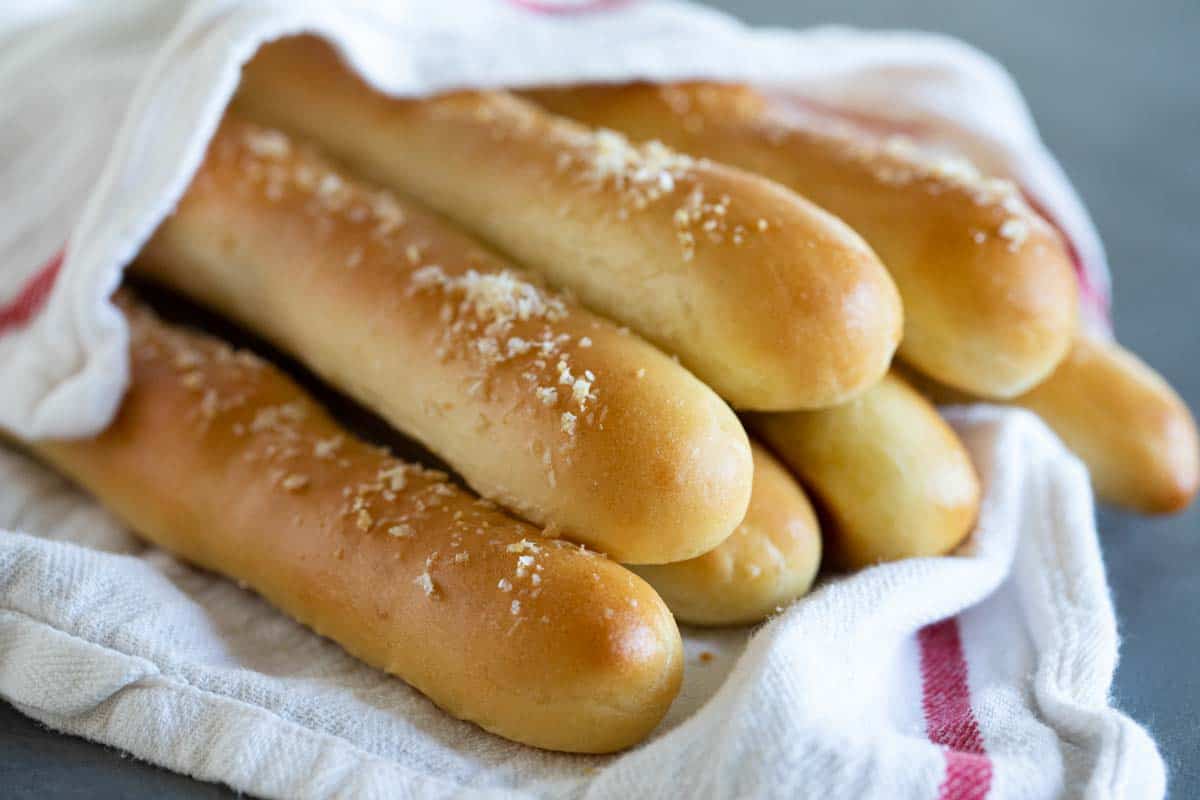 Breadsticks wrapped in a kitchen towel