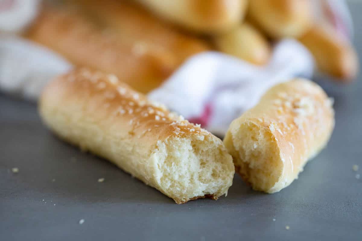 Breadstick broken in half to show fluffy texture