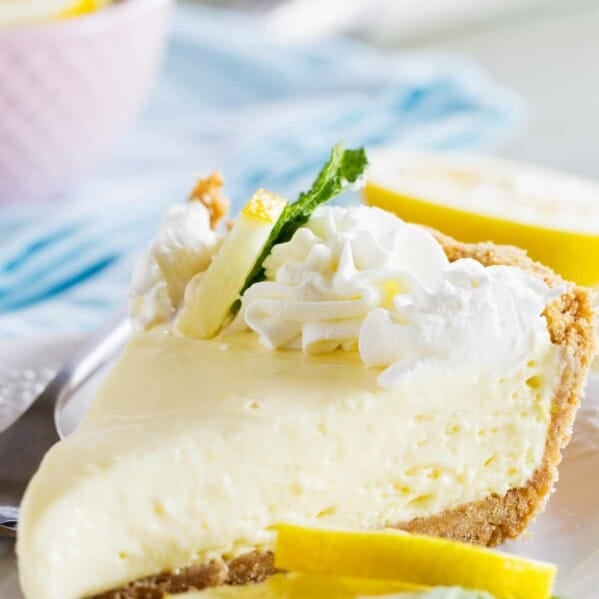 slice of lemon cream pie topped with whipped cream