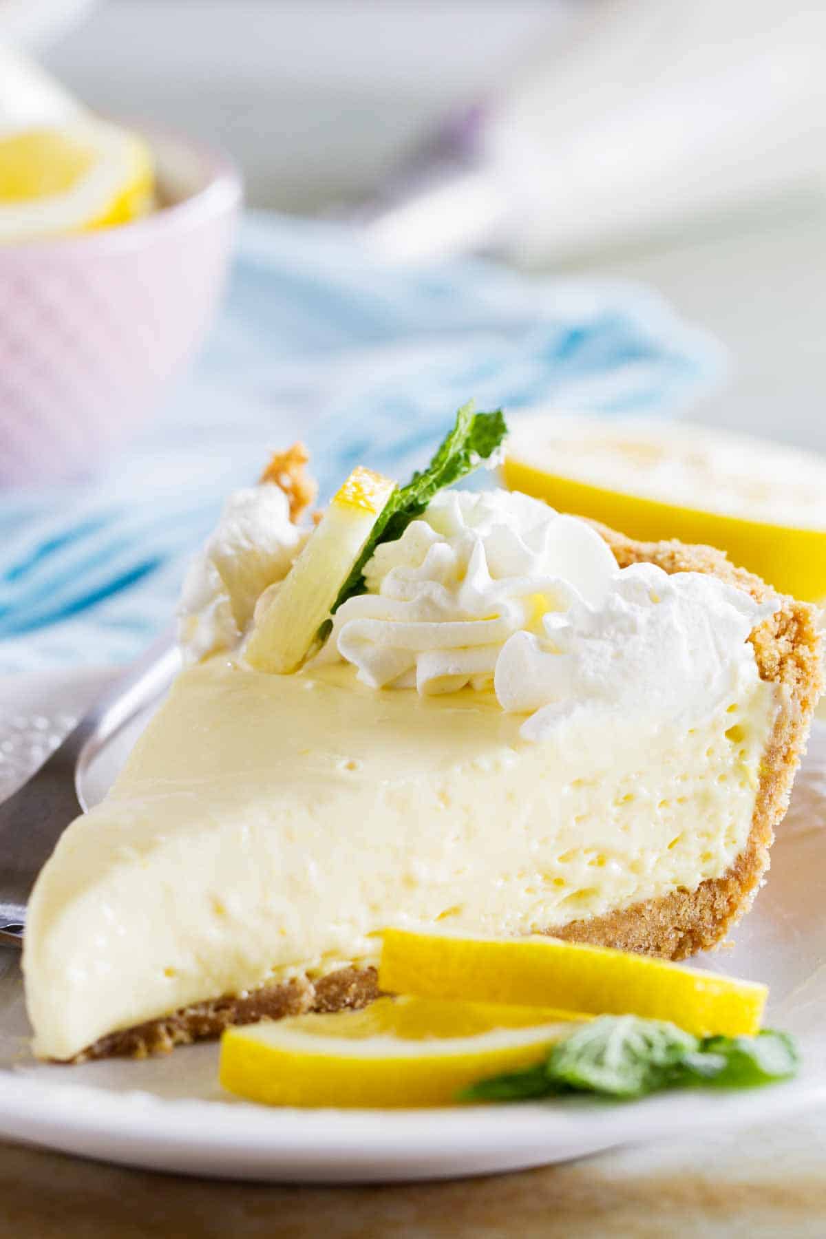 slice of lemon cream pie topped with whipped cream