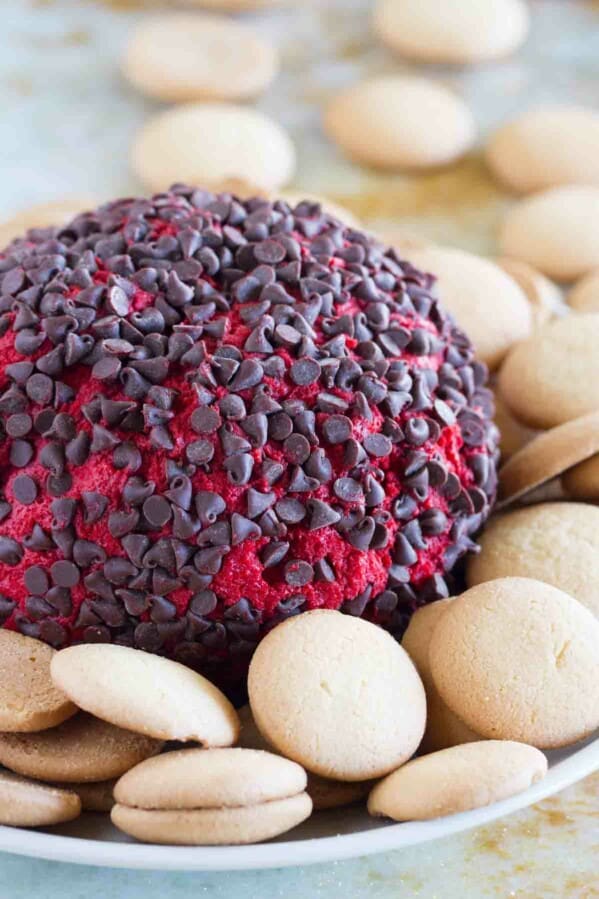 Red Velvet Cheese Ball on a plate with cookies