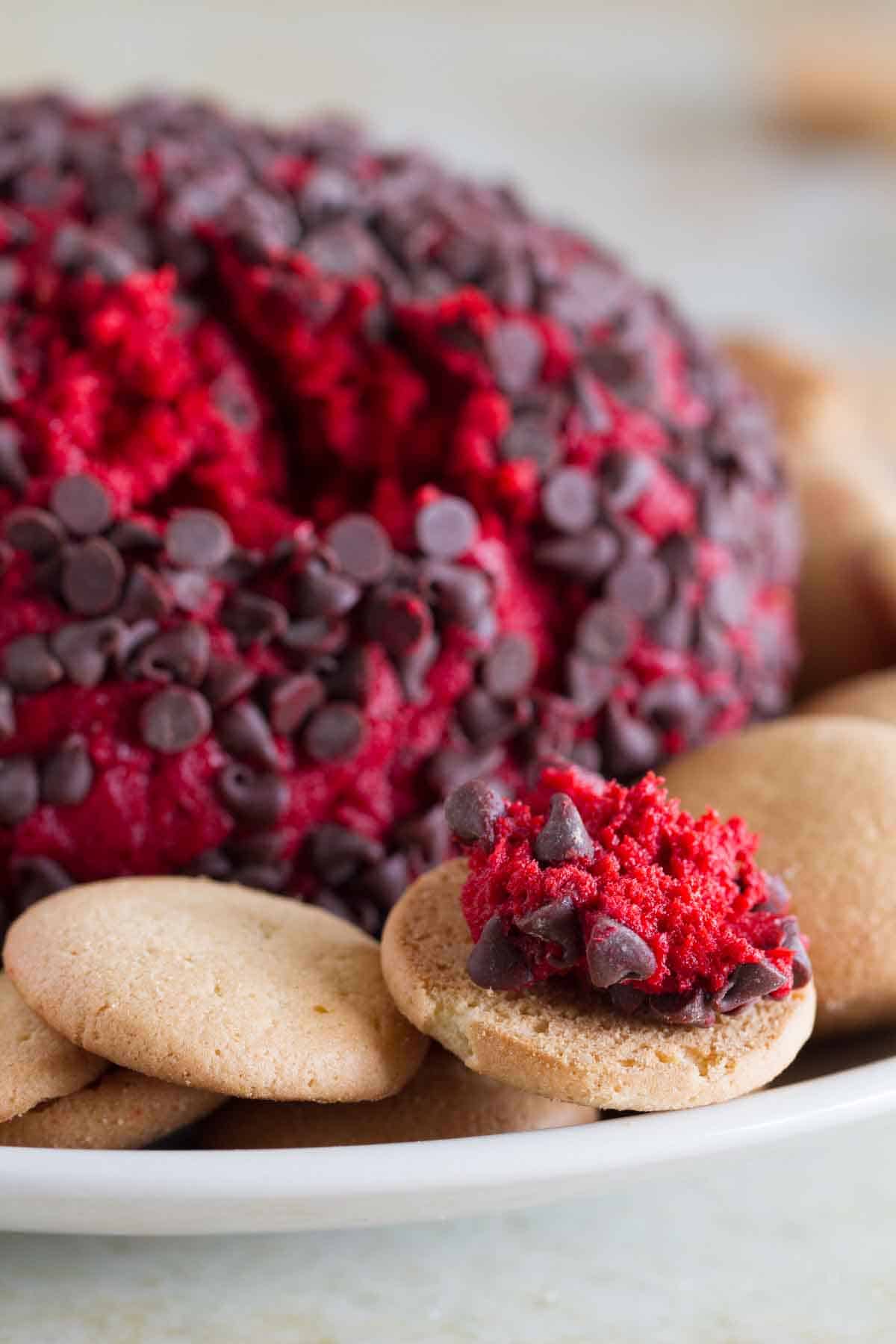 Red Velvet Cheese Ball with some on a vanilla wafer