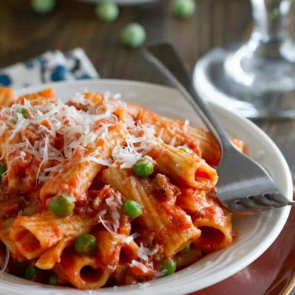Rigatoni with Sausage, Peas, Tomatoes and Cream in a dish