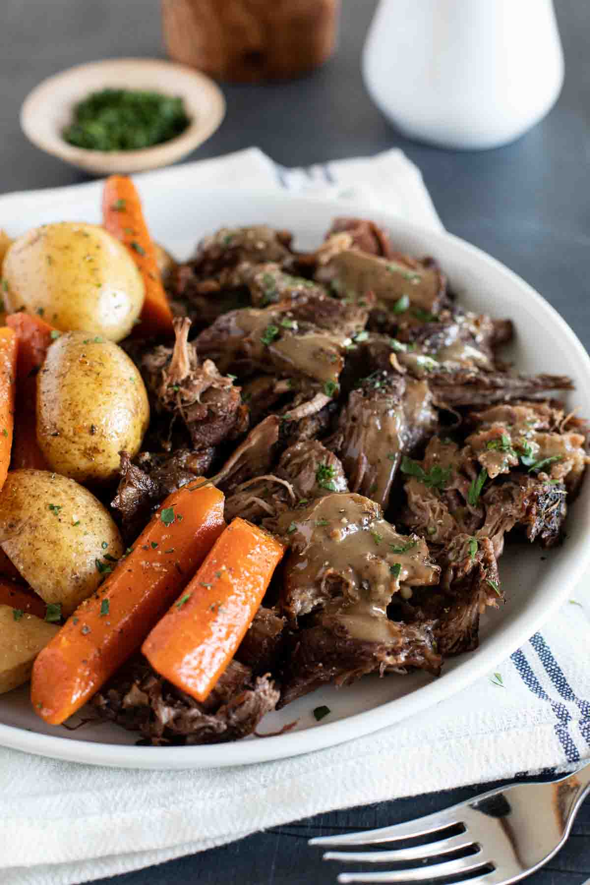 pot roast made in the slow cooker with gravy on top
