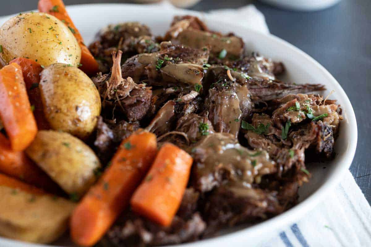 Pot Roast on a plate with vegetables and gravy